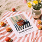 Enchilada Sauce – on Striped Tablecloth, Grocery Still Life, unframed on coastal sand