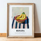Banana – on Striped Tablecloth, Fruit Wall Decor, in wooden frame leaning on the floor