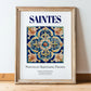 Saintes, France – Travel Poster, in wooden frame leaning on the floor